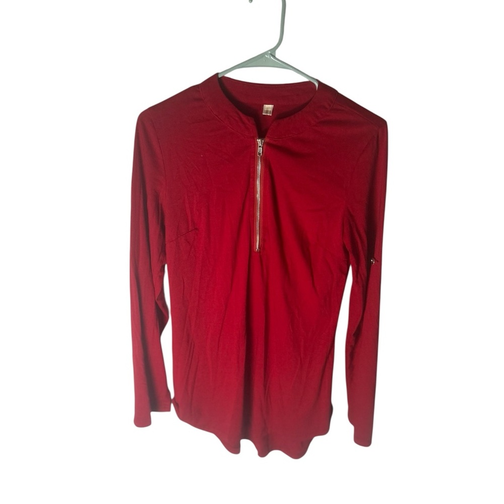 Comfortable red long sleeve shirt with front logo detail.